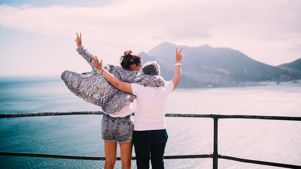 mother and daughter celebrate on a ferry