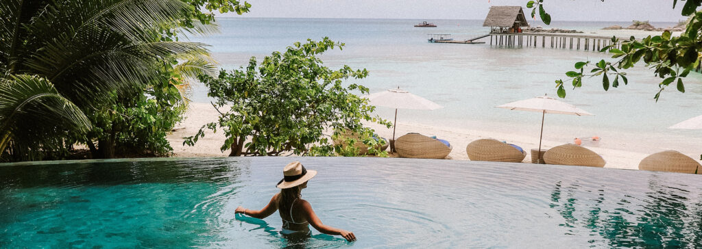 woman in pool on vacation