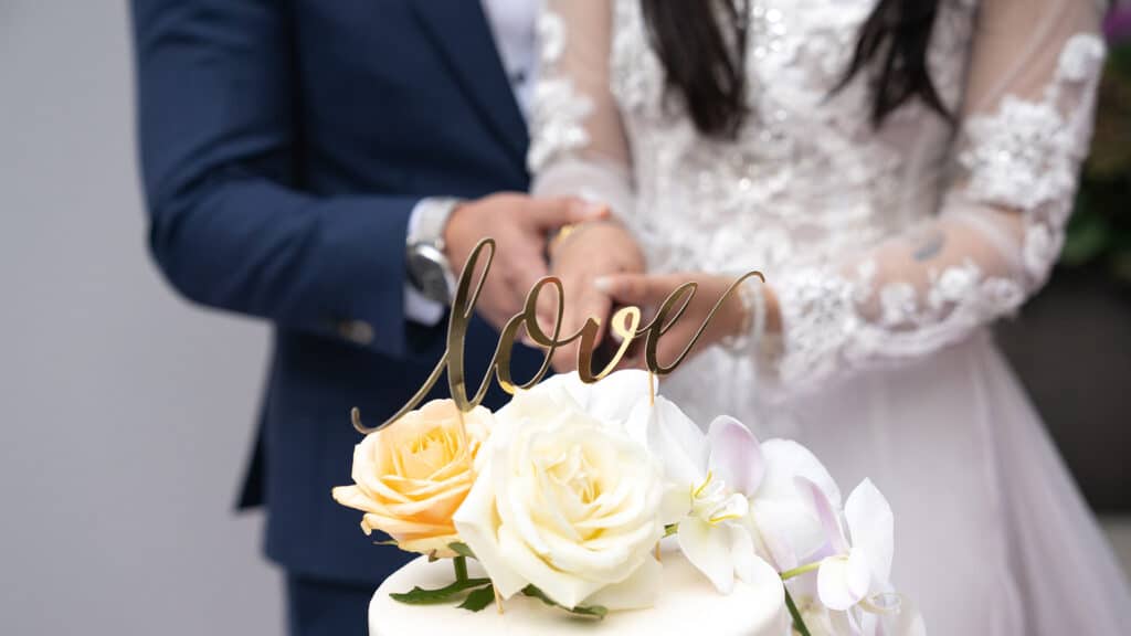 couple cutting wedding cake