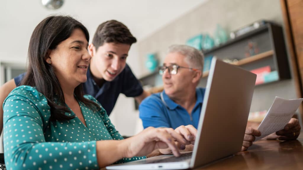 parents with teenage son going over finances