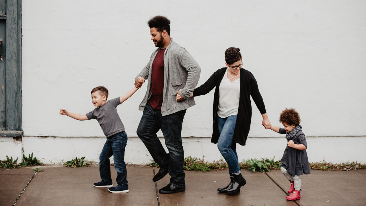 family walking on sidewalk