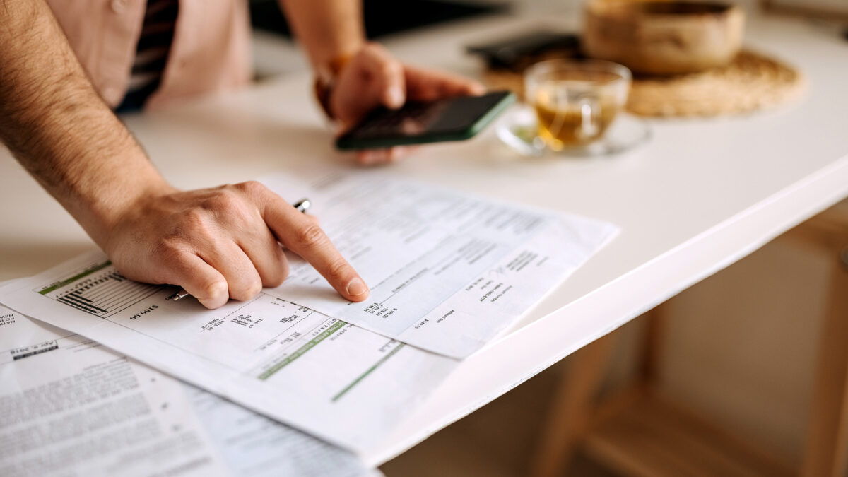 man working on finances