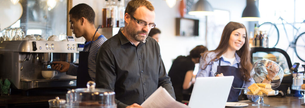 coffee shop manager on computer